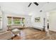 Bright living room with wood floors, a brick fireplace, and lots of natural light at 913 Tennessee Ln, Sarasota, FL 34234