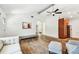Bright living room with wood floors, a mirror, and lots of natural light at 913 Tennessee Ln, Sarasota, FL 34234