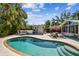 Inviting kidney-shaped pool with lounge seating in a private backyard with a shed at 913 Tennessee Ln, Sarasota, FL 34234