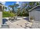 An outdoor patio with dining set adjacent to pool is perfect for entertaining at 913 Tennessee Ln, Sarasota, FL 34234
