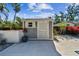 Backyard shed with convenient side entry and space for storage and potted plant decorations at 913 Tennessee Ln, Sarasota, FL 34234