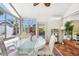 Cozy sunroom with abundant natural light and tile floor, perfect for relaxation and enjoying the outdoor view at 913 Tennessee Ln, Sarasota, FL 34234