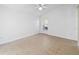 Bedroom with neutral tile flooring, a window, and a ceiling fan at 12511 Lake Vista Dr, Gibsonton, FL 33534