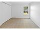 Bright bedroom with tile flooring, a double-door closet, and a sunny window at 12511 Lake Vista Dr, Gibsonton, FL 33534