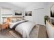 Bedroom with neutral decor, bedside tables, and decorative artwork at 12511 Lake Vista Dr, Gibsonton, FL 33534