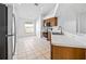 Functional kitchen featuring stainless steel appliances, oak cabinets, and tile flooring at 12511 Lake Vista Dr, Gibsonton, FL 33534