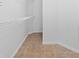 Small walk-in closet with neutral walls, floors, and wire shelving for storage at 12511 Lake Vista Dr, Gibsonton, FL 33534