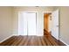 Bright bedroom with wood floors, closet, and open doorway at 2001 16Th S St, St Petersburg, FL 33705