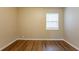 Bedroom featuring warm paint, modern window, and wood floors at 2001 16Th S St, St Petersburg, FL 33705