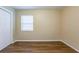 Bedroom featuring warm paint, modern window, and wood floors at 2001 16Th S St, St Petersburg, FL 33705