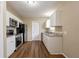 Modern kitchen featuring white cabinets, stainless steel appliances, and granite countertops at 2001 16Th S St, St Petersburg, FL 33705