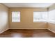 Spacious living room with wood flooring and natural light from multiple windows at 2001 16Th S St, St Petersburg, FL 33705