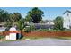Backyard featuring a screened in pool at 316 Country Club Dr, Oldsmar, FL 34677