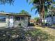 This home's exterior has a sidewalk leading up to the front door at 316 Country Club Dr, Oldsmar, FL 34677