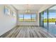 Bright dining room featuring sliding glass doors with views of the water and nearby trees at 8936 Sanders Tree Loop, Wesley Chapel, FL 33545