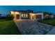 Beautiful home with a well-manicured lawn, a modern design, and a spacious driveway at 8936 Sanders Tree Loop, Wesley Chapel, FL 33545