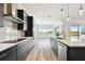 Contemporary kitchen boasts sleek cabinetry, stainless appliances, and an open layout at 8936 Sanders Tree Loop, Wesley Chapel, FL 33545