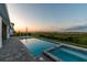 Gorgeous pool with a spa and lake view, perfect for relaxation and enjoying the outdoors at 8936 Sanders Tree Loop, Wesley Chapel, FL 33545