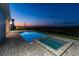 A gorgeous in-ground pool and jacuzzi with brick pavers overlooking the water at 8936 Sanders Tree Loop, Wesley Chapel, FL 33545