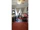 Functional bedroom with a bed, desk, and a window providing natural light at 6639 Renaldo S Way, St Petersburg, FL 33707
