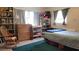 Cozy bedroom featuring wood furnishings and plenty of storage space at 6639 Renaldo S Way, St Petersburg, FL 33707