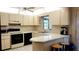 Bright, clean kitchen featuring white countertops and modern appliances at 6639 Renaldo S Way, St Petersburg, FL 33707