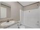 Bathroom featuring a single sink vanity, framed mirror, and a shower/tub combo at 8857 Highpoint Blvd, Brooksville, FL 34613