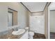 Bright bathroom with a single sink vanity, framed mirror, and walk-in shower at 8857 Highpoint Blvd, Brooksville, FL 34613