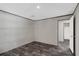 Nicely sized bedroom with durable vinyl plank flooring and neutral colored walls at 8857 Highpoint Blvd, Brooksville, FL 34613