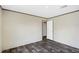 Comfortable bedroom featuring wood-look floors, light colored walls, and closet at 8857 Highpoint Blvd, Brooksville, FL 34613