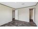 This bedroom has vinyl plank floors, light walls, and two closets with white doors at 8857 Highpoint Blvd, Brooksville, FL 34613
