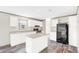 Bright kitchen with white cabinets, a granite-look countertop, and stainless steel appliances at 8857 Highpoint Blvd, Brooksville, FL 34613