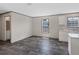 Open living area features hardwood floors and plenty of natural light at 8857 Highpoint Blvd, Brooksville, FL 34613