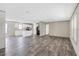 A well-lit living room with hardwood floors is ready for you to make it your own at 8857 Highpoint Blvd, Brooksville, FL 34613