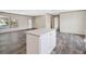 Open living space with hardwood floors and lots of natural light through a window at 8857 Highpoint Blvd, Brooksville, FL 34613
