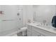 Bathroom featuring a glass-enclosed shower, white vanity, and neutral tile flooring at 920 N Osceola Ave # 803, Clearwater, FL 33755