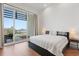 Bedroom offering water views, herringbone wood floors, and access to a balcony at 920 N Osceola Ave # 803, Clearwater, FL 33755