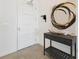 Entryway with a stylish console table, modern art, and a three-panel interior door at 920 N Osceola Ave # 803, Clearwater, FL 33755