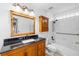Bathroom featuring traditional cabinetry and a shower-tub combination at 754 Cape Cod Cir, Valrico, FL 33594