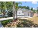 Charming home with a manicured lawn, decorative front, and a well-lit exterior, perfect for evening enjoyment at 754 Cape Cod Cir, Valrico, FL 33594