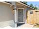 Inviting front entry with decorative door, secured gate, and a 'Beware of Dog' sign at 754 Cape Cod Cir, Valrico, FL 33594