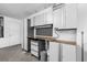 Garage workspace with white cabinets, counters and pegboard at 754 Cape Cod Cir, Valrico, FL 33594