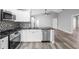 Modern kitchen showcasing stainless appliances, stylish backsplash, sleek countertops, and seamless open-concept living at 754 Cape Cod Cir, Valrico, FL 33594