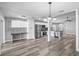Open concept kitchen and dining area with stainless steel appliances and laminate flooring at 754 Cape Cod Cir, Valrico, FL 33594