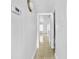Bright hallway with tile flooring leading to a room with a window at 8608 Huron Ct # 57, Tampa, FL 33614