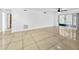 Bright living room with tile floors and sliding glass doors to the outdoors at 8608 Huron Ct # 57, Tampa, FL 33614