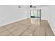 Bright living room with tile flooring and sliding glass doors leading to outdoor space at 8608 Huron Ct # 57, Tampa, FL 33614