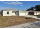 Charming single-story home featuring a two-car garage and freshly landscaped yard at 2310 Logsdon St, North Port, FL 34287