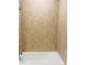 Bathroom shower featuring tiled walls and white porcelain tub at 29307 Meadowcroft Ave, Wesley Chapel, FL 33544