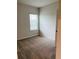 Carpeted bedroom featuring a window for natural light at 29307 Meadowcroft Ave, Wesley Chapel, FL 33544